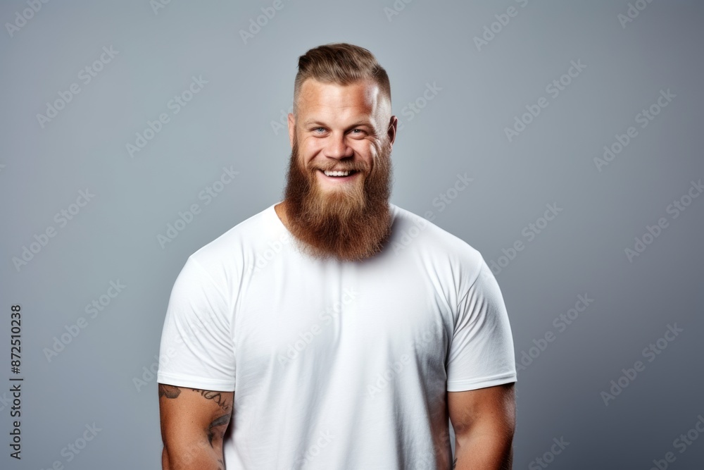 Portrait of a handsome bearded man in white t-shirt. Portrait of a handsome bearded man in white t-shirt.