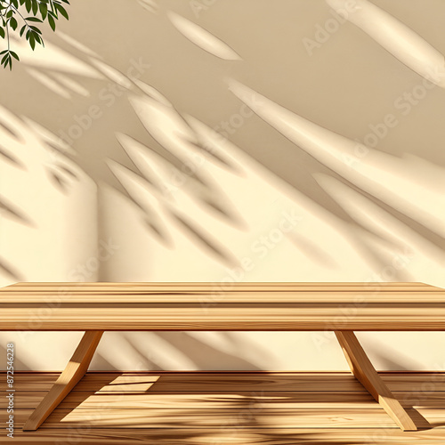 Empty wood table top on beige wall texture with tree leaves shadow background