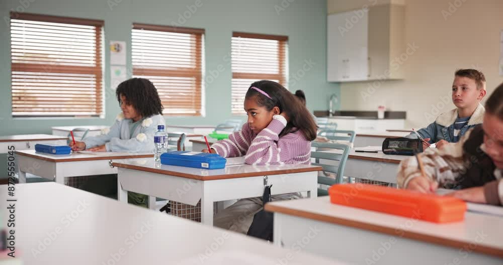 Exam, writing and students in classroom for education, learning and pencil for assessment in elementary school. Quiz, studying and knowledge for group of people, curriculum and desk for course test Exam, writing and students in classroom for education, learning and pencil for assessment in elementary school. Quiz, studying and knowledge for group of people, curriculum and desk for course test