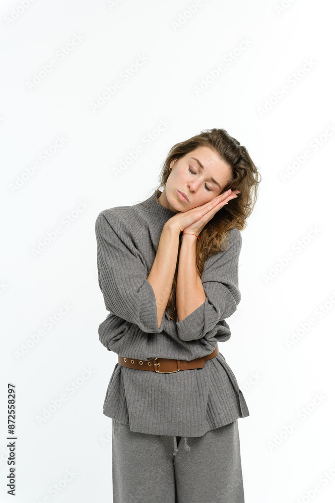 Woman wants to sleep resting her head on her hands with her eyes closed. Woman wants to sleep resting her head on her hands with her eyes closed.