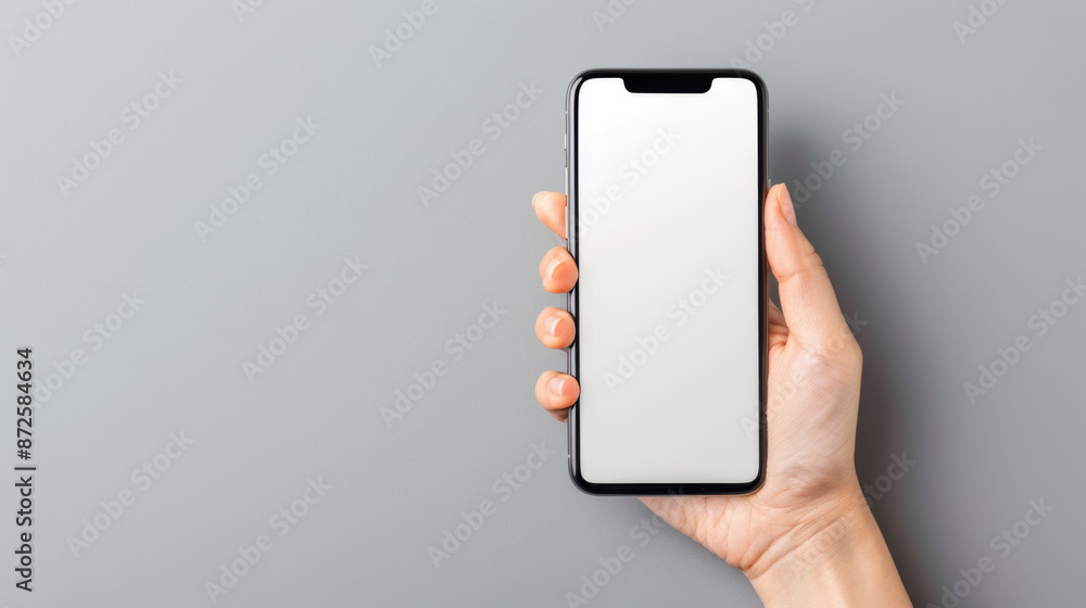 Mockup of hand holding blank smartphone showcasing app design or mobile websites Mockup of hand holding blank smartphone showcasing app design or mobile websites
