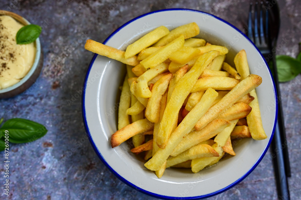 Home made Fresh fried French fries in a bowl on wooden rustic background Home made Fresh fried French fries in a bowl on wooden rustic background