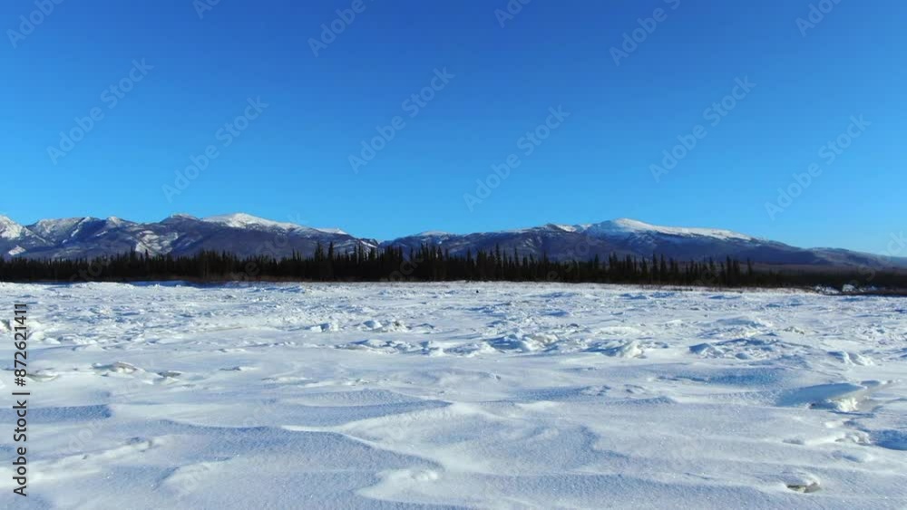 Aerial: Scenic Shot Of Mountains Against Clear Sky, Drone Flying Forward Over Snowy Landscape On Sunny Day - Calico Bluff, Alaska Aerial: Scenic Shot Of Mountains Against Clear Sky, Drone Flying Forward Over Snowy Landscape On Sunny Day - Calico Bluff, Alaska