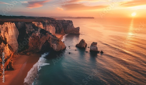 Fototapeta Naklejka Na Ścianę i Meble -  Breathtaking aerial view of a sandy beach with cliffs alongside it, tourist spot, scenic view, sunset