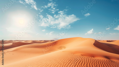 A quiet desert landscape with golden sand dunes stretching under a blue sky, with no one around.