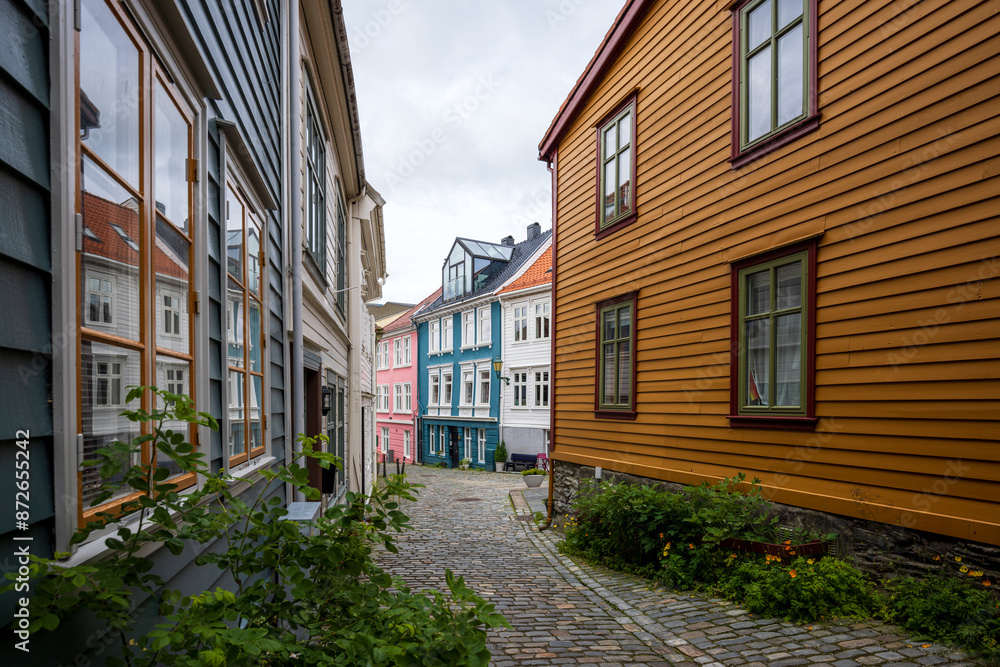 Charming alleyway with cobblestone path in old town in Bergen, Norway Charming alleyway with cobblestone path in old town in Bergen, Norway