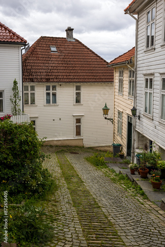 Charming old town alley with cobblestone path in Bergen, Norway