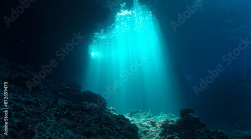 Underwater photo of rays of sunlight inside a cave. From a scuba dive in Thailand.