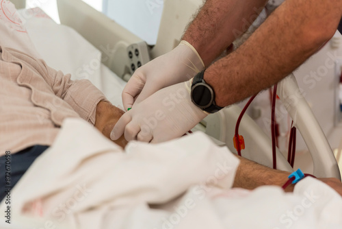 Close-up image of dialysis patients receiving treatment for kidney failure