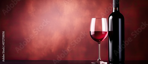 Red wine in a glass and bot...