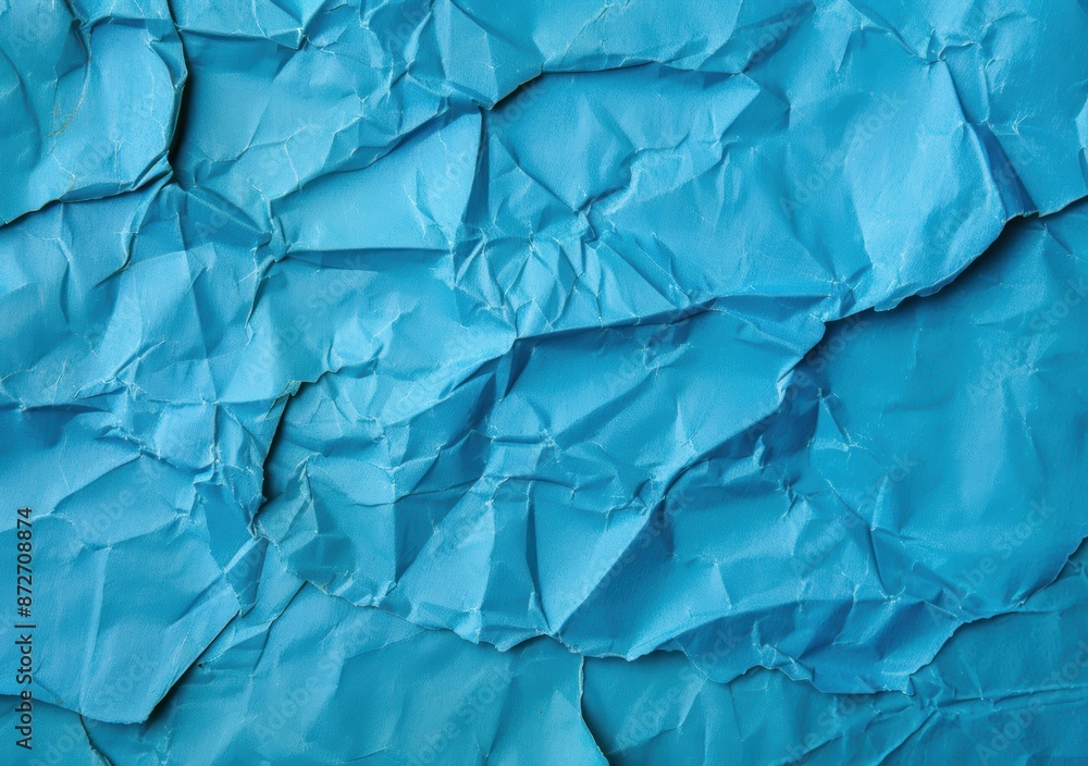 Obraz premium crumpled blue paper texture background