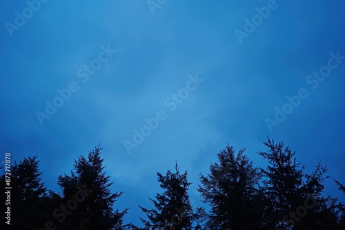 a blue sky with some clouds and some trees