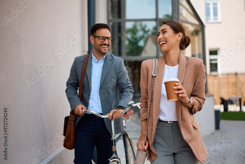 Billede på lærred Happy businesswoman and her colleague having fun while leaving office after work