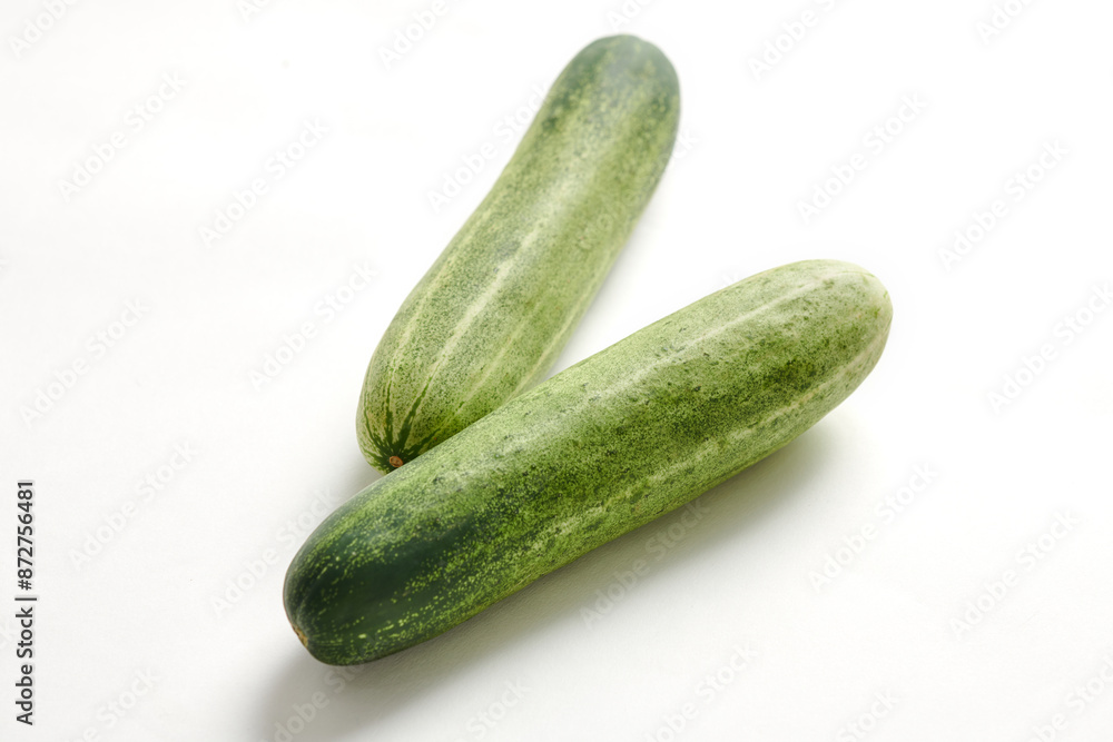 Two cucumbers on an isolated white background Two cucumbers on an isolated white background