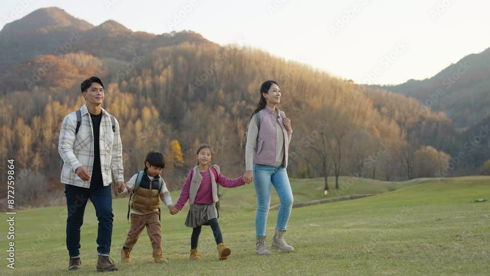 Happy young family hiking outdoors Happy young family hiking outdoors
