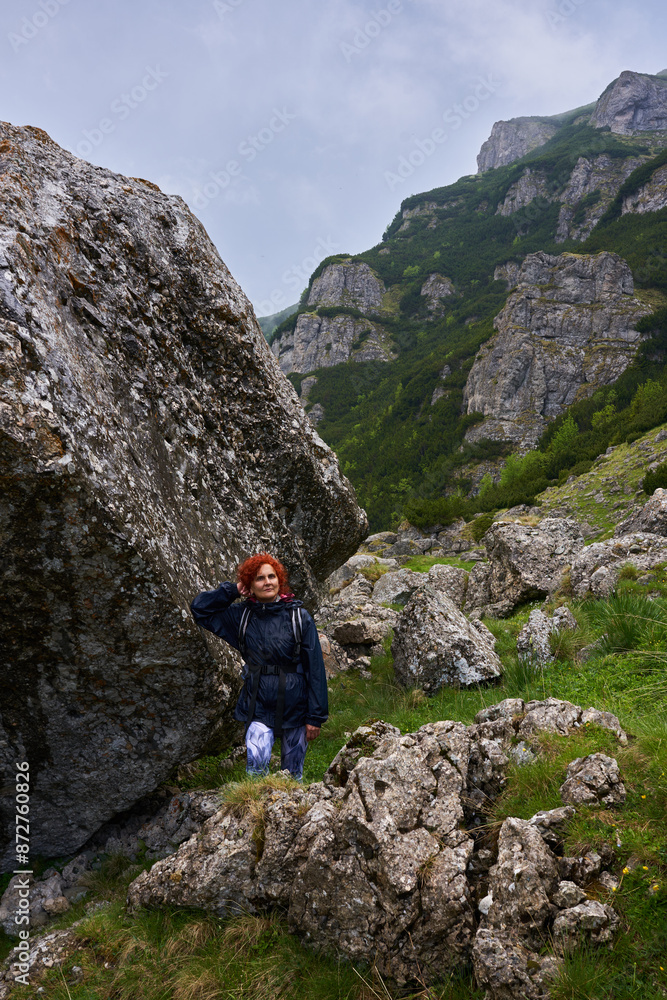 Woman hiker in a rainy day in the mountains Woman hiker in a rainy day in the mountains