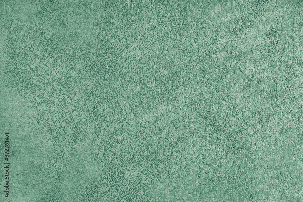 Naklejka premium Green suede leather texture with embossed pattern background, fleecy cloth texutre macro