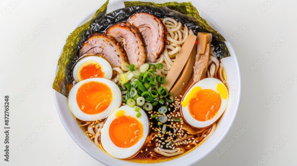 A bowl of ramen with rich broth, soft-boiled eggs, sliced pork, nori, and scallions. Isolated on pure white background A bowl of ramen with rich broth, soft-boiled eggs, sliced pork, nori, and scallions. Isolated on pure white background