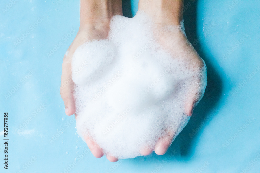 Fototapeta premium hand with soap bubbles