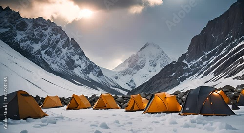 Tents at a base camp on a snowy mountain. photo