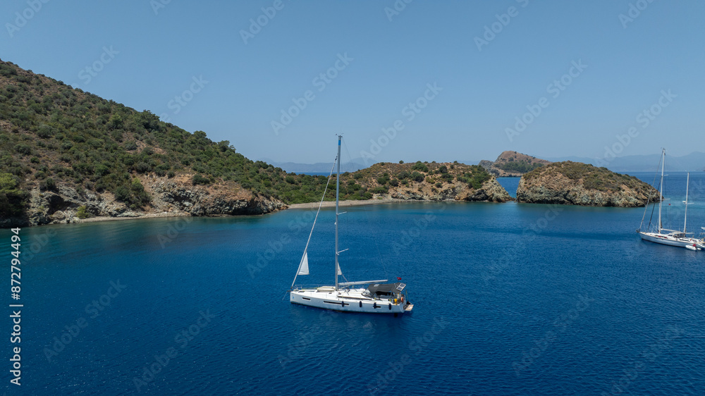 Aerial view of a sail boat on the shallow water. Aerial view of a sail boat on the shallow water.