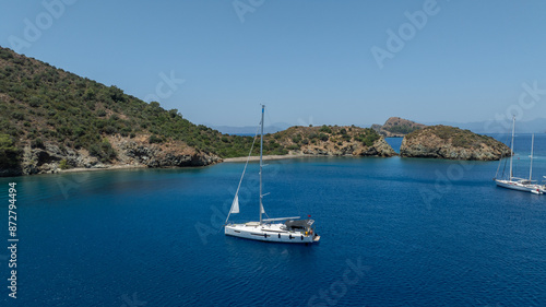 Aerial view of a sail boat on the shallow water. 