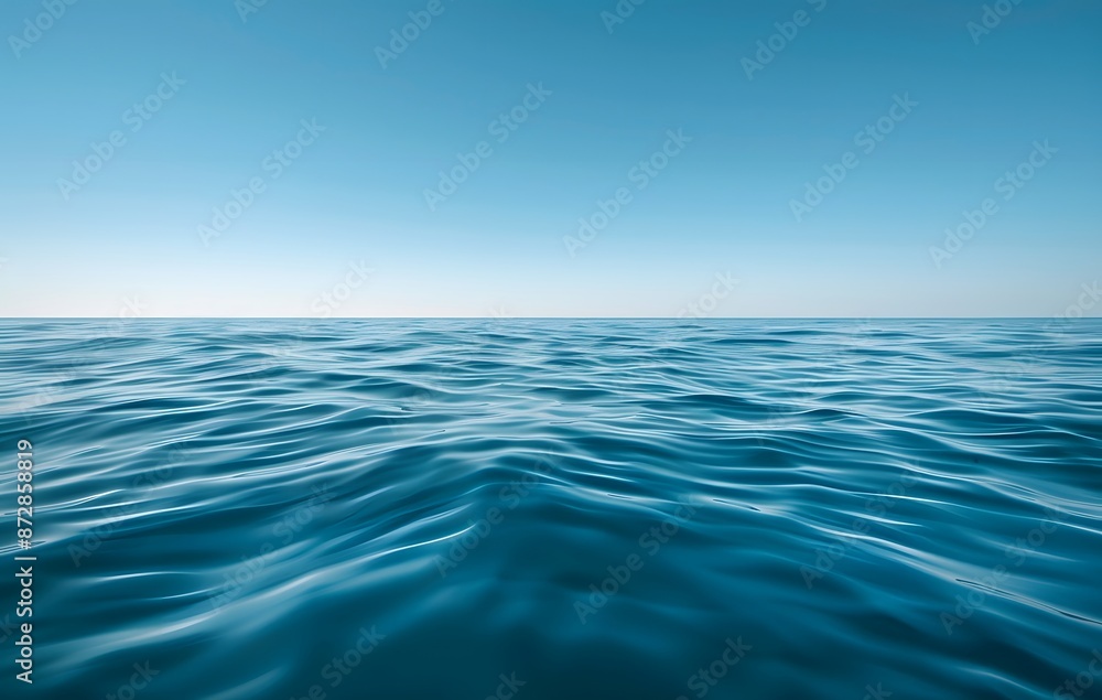 Obraz premium Tranquil Ocean Waves Under Clear Blue Sky