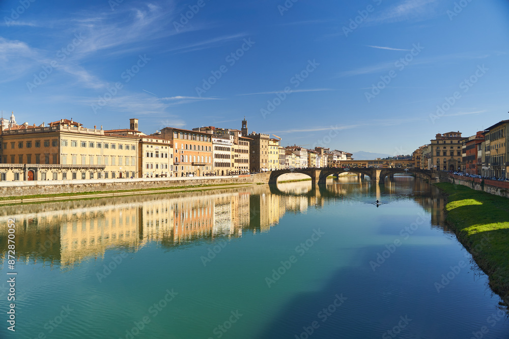 Naklejka premium View of the river Arno and buildings from the embankment in Florence. High quality photo