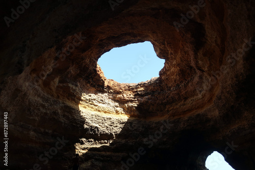 Praia de Benagil is located on one of the most beautiful stretches of the Algarve coast, where the jagged cliffs form caves and sinkholes. Algarve, Portugal.