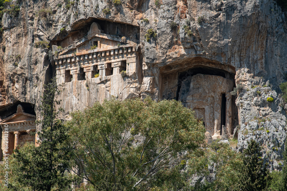 Fethiye King Tombs,carved into the rock tomb 4th century BC. The Lycian Amintas King Tombs. Tombs of Telmessos Ancient City in Fethiye, Amyntas Rock. Fethiye King Tombs,carved into the rock tomb 4th century BC. The Lycian Amintas King Tombs. Tombs of Telmessos Ancient City in Fethiye, Amyntas Rock.