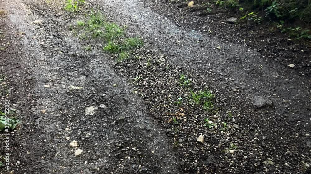 gravel road washed out by torrential rain gravel road washed out by torrential rain