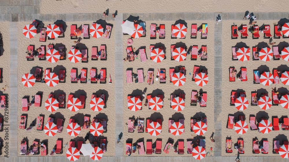 Fototapeta premium Red Umbrellas In the Beach Aerial