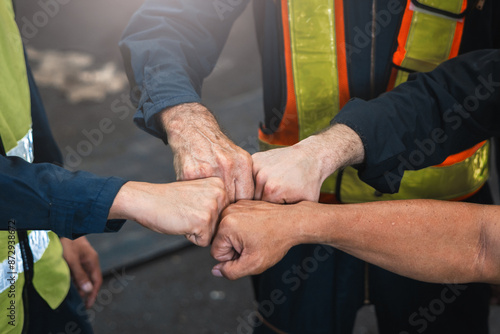 Cuadro en lienzo group of construction workers are fist bumping each other
