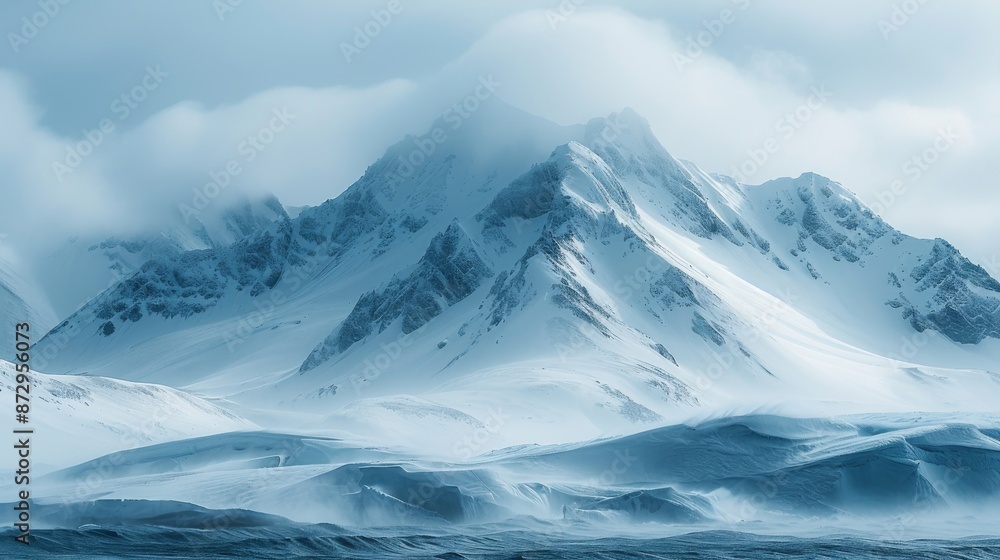 Amid the harsh winter cold, snow-covered mountains stretch into the distance Amid the harsh winter cold, snow-covered mountains stretch into the distance