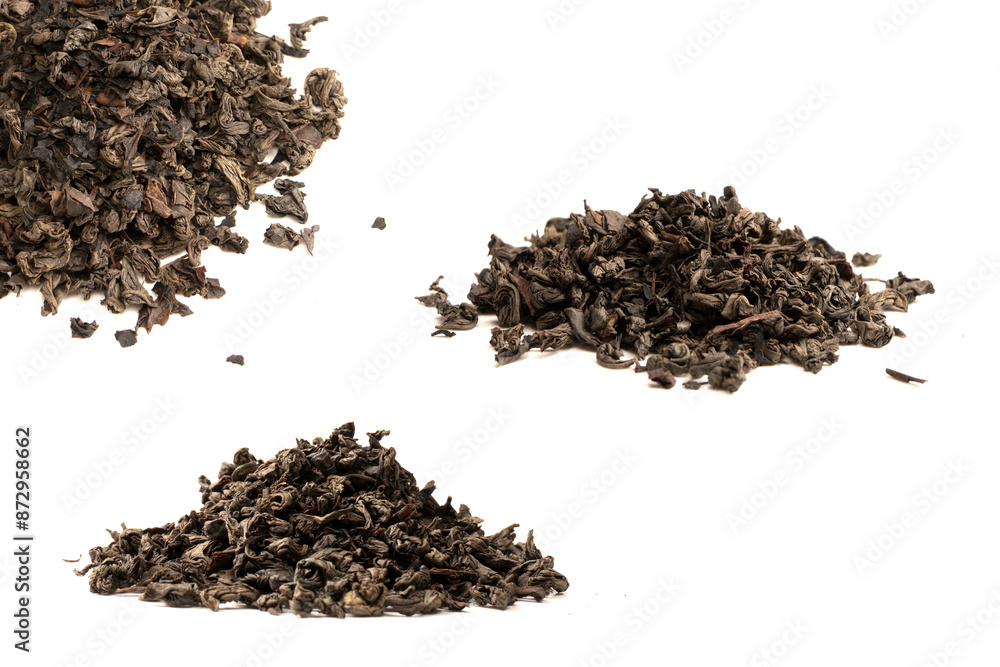 Dried tea leaves isolated on a white background. Dried tea leaves isolated on a white background.