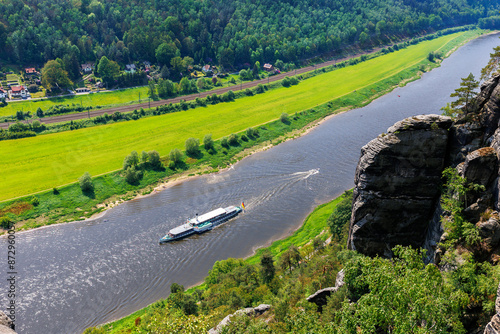 Panoramic scenic view vintage steam paddle boat cruising Elbe river curve at Sachsische Schweiz National Park Germany from Bastei Sandstone mountain valley. Europe travel nature landscape destination photo