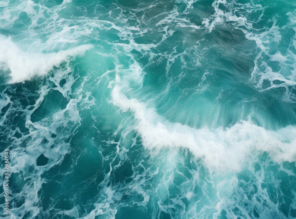 Aerial view of turquoise ocean waves crashing on a sandy beach Aerial view of turquoise ocean waves crashing on a sandy beach