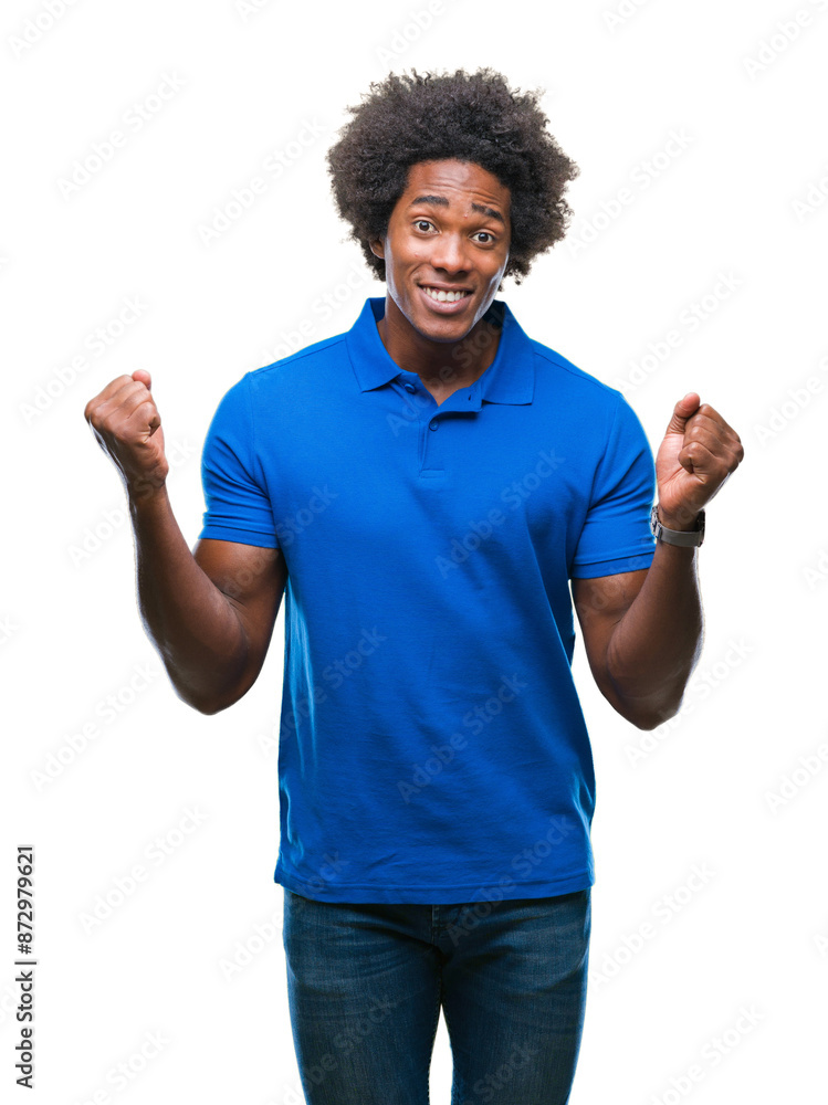 Afro american man over isolated background celebrating surprised and amazed for success with arms raised and open eyes. Winner concept. Afro american man over isolated background celebrating surprised and amazed for success with arms raised and open eyes. Winner concept.