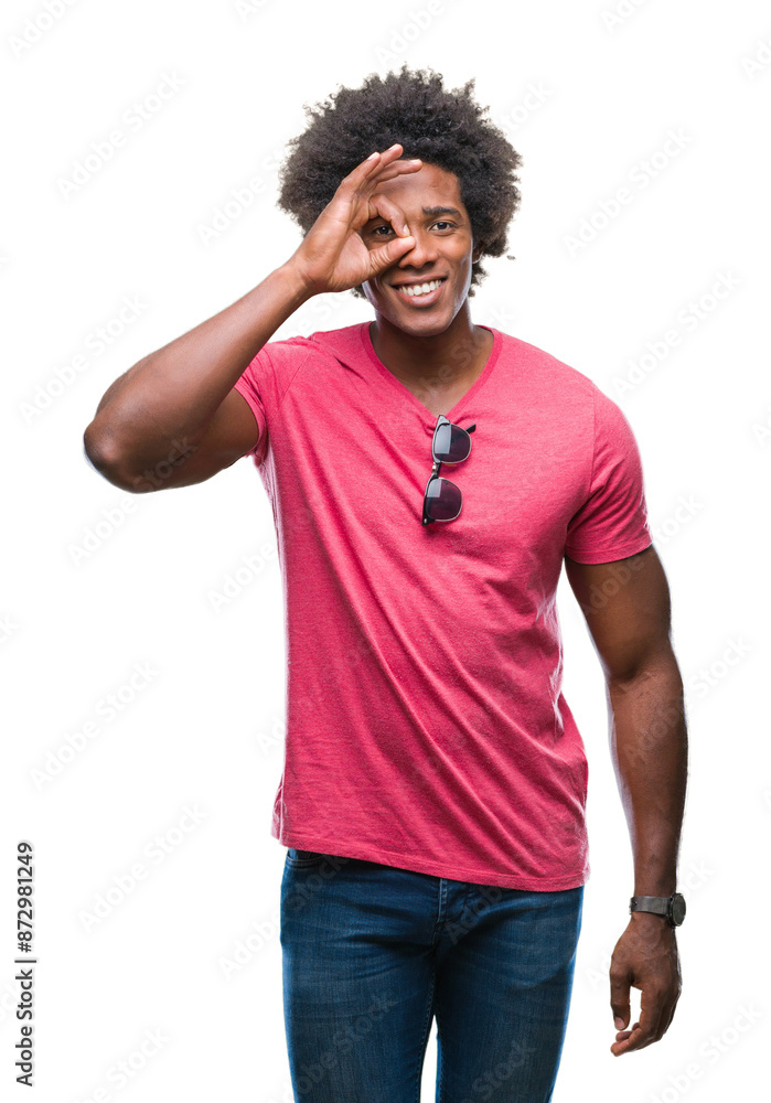 Afro american man over isolated background doing ok gesture with hand smiling, eye looking through fingers with happy face. Afro american man over isolated background doing ok gesture with hand smiling, eye looking through fingers with happy face.