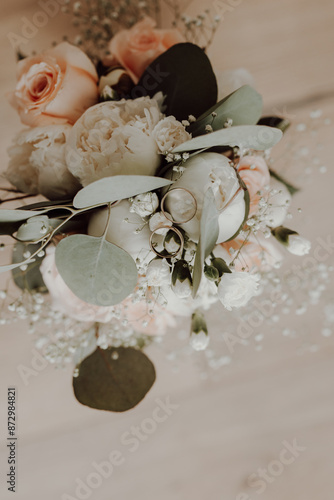 Wedding flower buquet with wedding rings photo