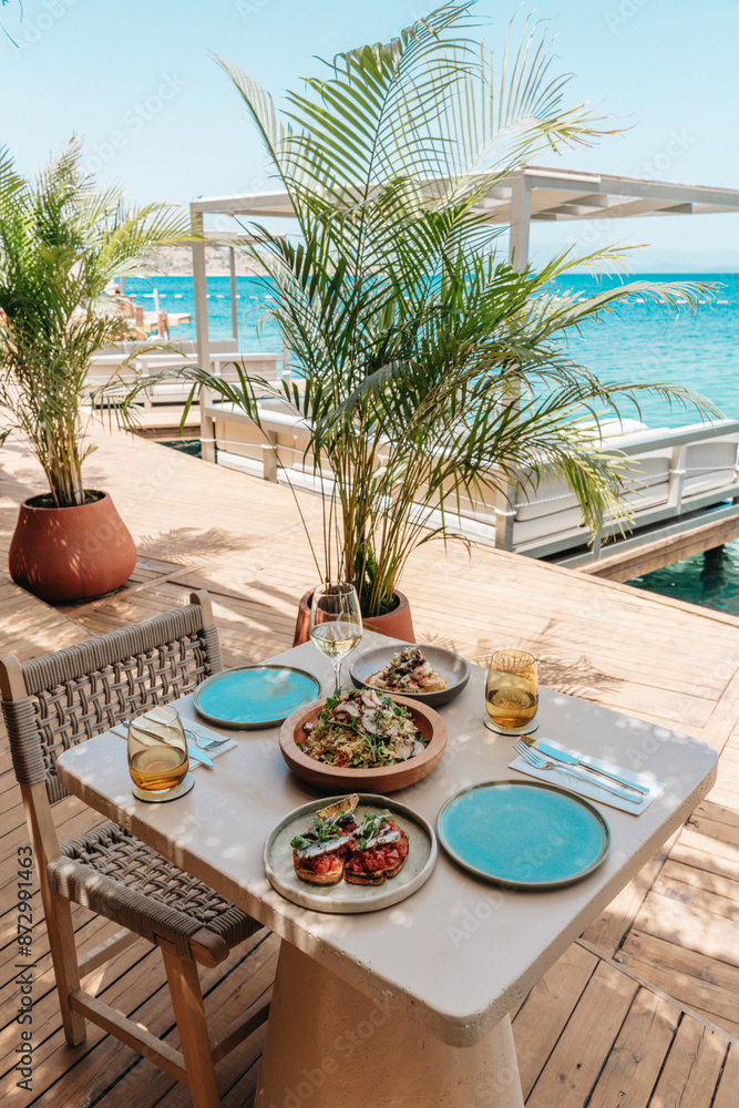 Fototapeta premium table and chairs on the beach food