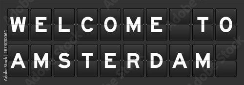 Black color analog flip board with word welcome to amsterdam on gray background