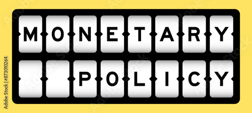 Black color in word monetary policy on slot banner with yellow color background