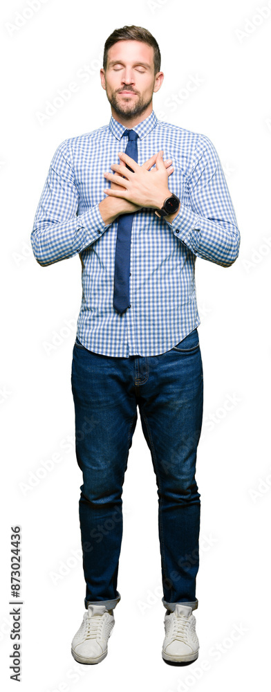 Handsome business man wearing tie smiling with hands on chest with closed eyes and grateful gesture on face. Health concept. Handsome business man wearing tie smiling with hands on chest with closed eyes and grateful gesture on face. Health concept.