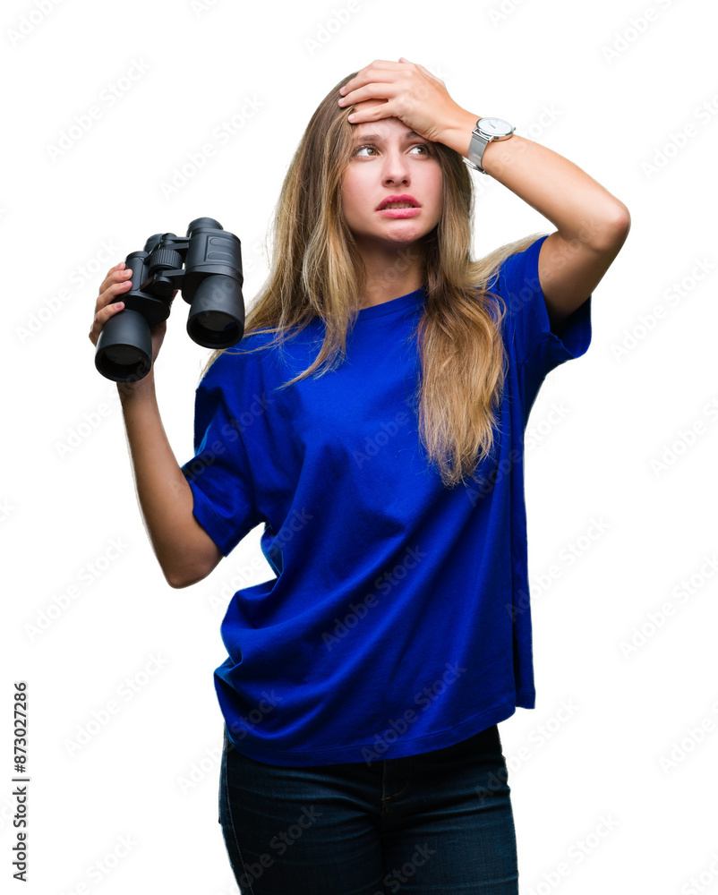 Young beautiful blonde woman looking through binoculars over isolated background stressed with hand on head, shocked with shame and surprise face, angry and frustrated. Fear and upset for mistake. Young beautiful blonde woman looking through binoculars over isolated background stressed with hand on head, shocked with shame and surprise face, angry and frustrated. Fear and upset for mistake.