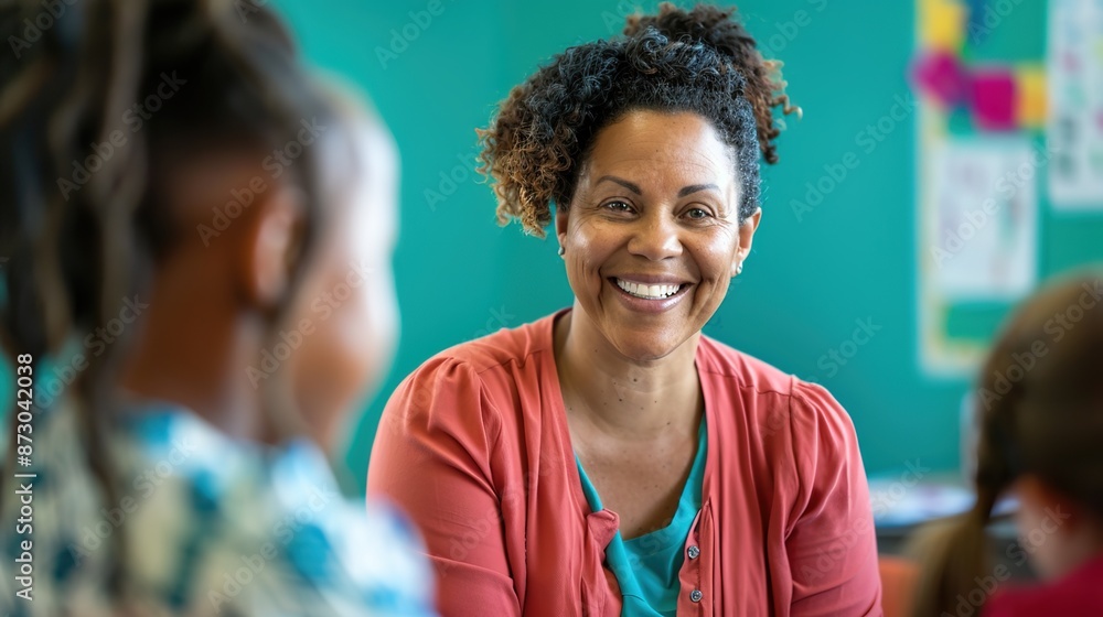 Inspiring Teacher Connecting with Students in Classroom Setting with Teal Wall Background for Copy Space