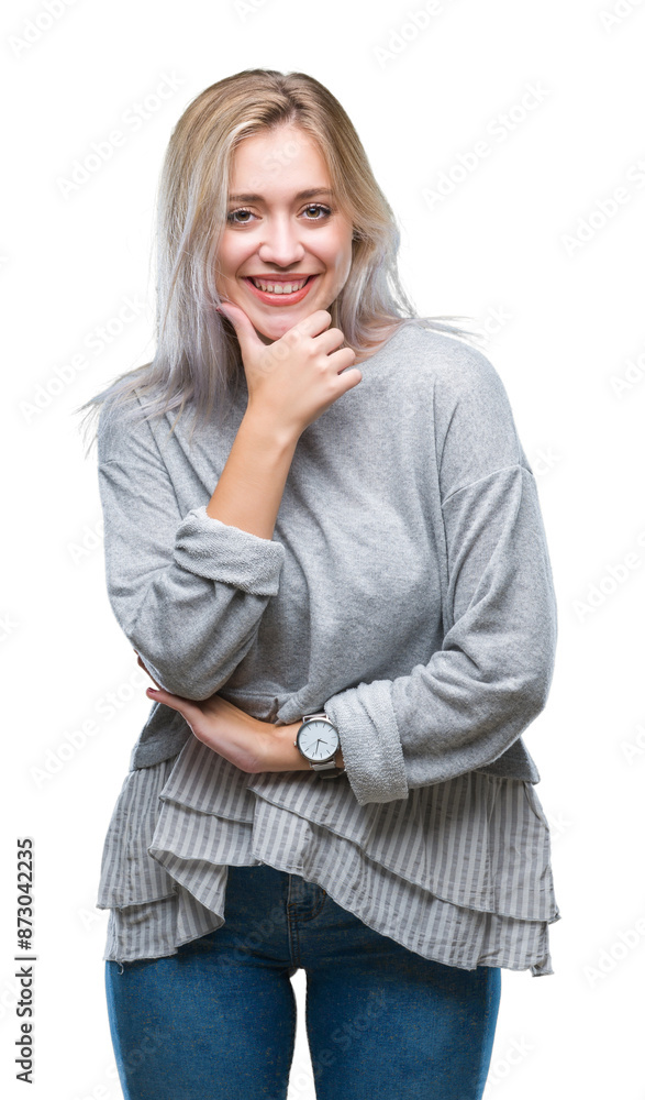 Young blonde woman over isolated background looking confident at the camera with smile with crossed arms and hand raised on chin. Thinking positive. Young blonde woman over isolated background looking confident at the camera with smile with crossed arms and hand raised on chin. Thinking positive.