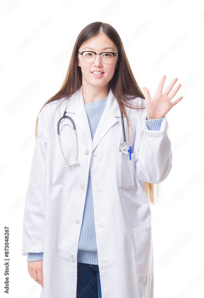 Young Chinese doctor woman over isolated background showing and pointing up with fingers number five while smiling confident and happy. Young Chinese doctor woman over isolated background showing and pointing up with fingers number five while smiling confident and happy.