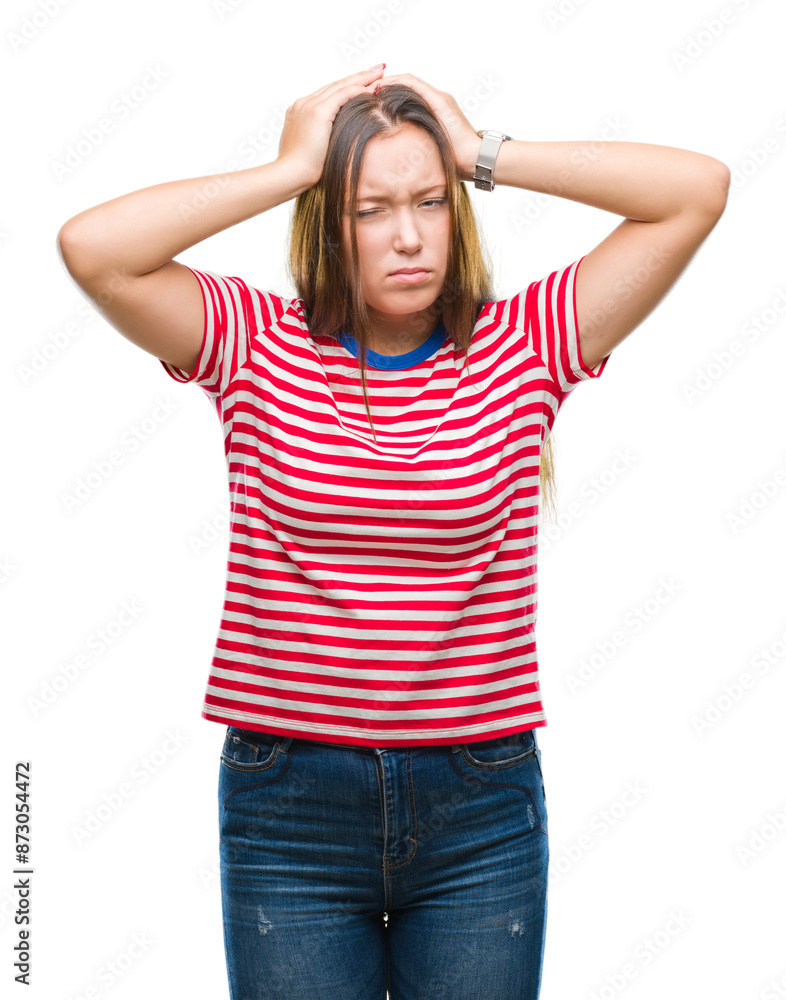 Young caucasian beautiful woman over isolated background suffering from headache desperate and stressed because pain and migraine. Hands on head. Young caucasian beautiful woman over isolated background suffering from headache desperate and stressed because pain and migraine. Hands on head.