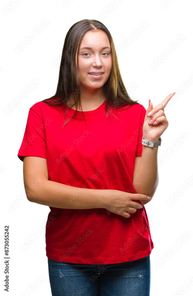 Young beautiful caucasian woman over isolated background with a big smile on face, pointing with hand and finger to the side looking at the camera. Young beautiful caucasian woman over isolated background with a big smile on face, pointing with hand and finger to the side looking at the camera.